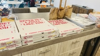 Pizza boxes collected as part of a donation drive