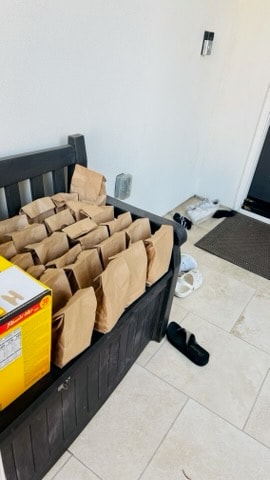 Brown paper bags packed with donations on a bench
