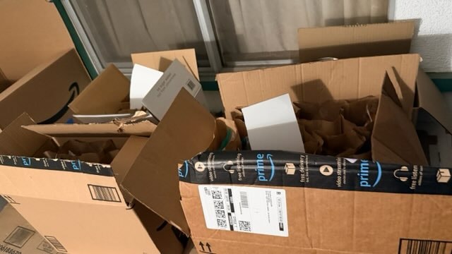 Amazon boxes packed with donated supplies and meals
